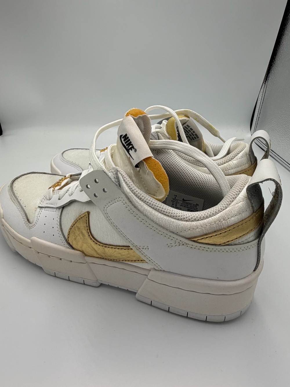 Nike White and Gold Low-Top Sneakers